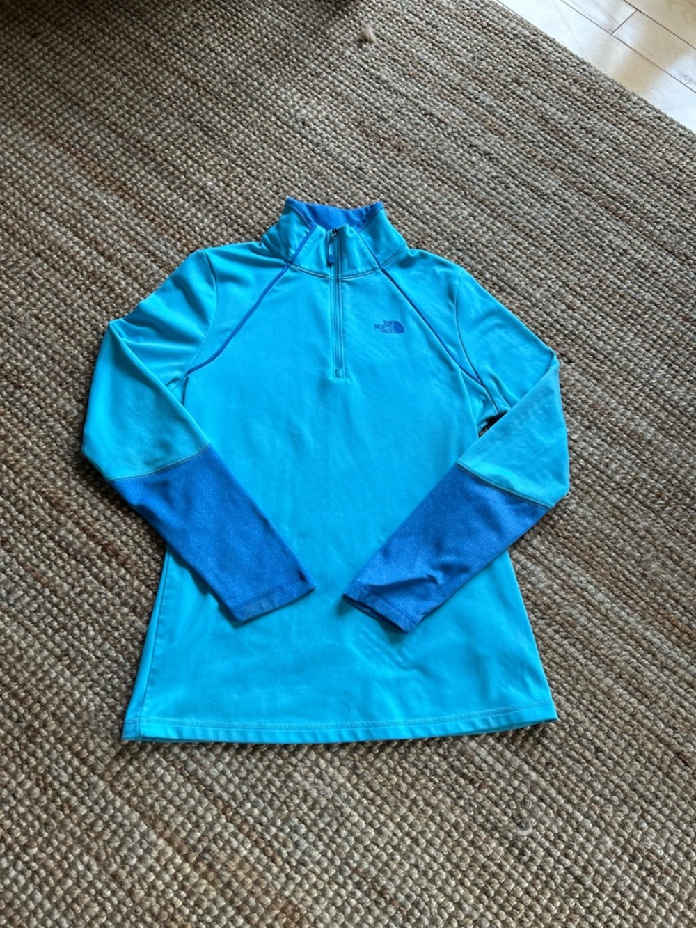 The North Face Bright Turquoise 1/4 Zip Pullover with Deep Blue Sleeve Panels